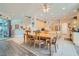 Bright dining area open to kitchen with ample seating and natural light from sliding glass doors at 1831 Rosemere Ct, Las Vegas, NV 89117