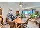 Bright dining area featuring a wood table set, large windows, wood floors, and ample natural light at 1831 Rosemere Ct, Las Vegas, NV 89117