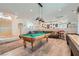 Entertaining game room with a pool table, shuffleboard, stylish decor, and an open layout at 1831 Rosemere Ct, Las Vegas, NV 89117
