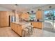 Well-lit kitchen with stainless steel appliances, granite countertops, a central island, and plenty of cabinet space at 1831 Rosemere Ct, Las Vegas, NV 89117
