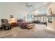 Oversized main bedroom with a sitting area, fireplace, plush carpeting, and ample natural light at 1831 Rosemere Ct, Las Vegas, NV 89117