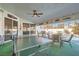 Outdoor patio with ceiling fan, lights, ping pong table, and outdoor seating at 1831 Rosemere Ct, Las Vegas, NV 89117