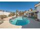 Backyard pool with waterfall feature, lounge chairs, and adjacent covered patio at 1831 Rosemere Ct, Las Vegas, NV 89117