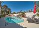 Sparkling private pool surrounded by lush landscaping and comfortable lounging areas at 1831 Rosemere Ct, Las Vegas, NV 89117
