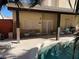 Charming covered patio featuring comfortable seating and a refreshing view of the sparkling pool at 1913 April Mist St, Henderson, NV 89002