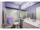 This updated bathroom features a sleek vanity, a large mirror, and a stylish glass-enclosed shower at 1933 Orchard Valley Dr, Las Vegas, NV 89142