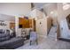 Inviting entryway with wood-look tile flooring, stairway to the second floor, and stylish decor at 1933 Orchard Valley Dr, Las Vegas, NV 89142