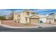 Charming two-story home with a well-maintained lawn and a two-car garage at 1933 Orchard Valley Dr, Las Vegas, NV 89142