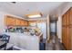 Spacious kitchen with granite countertops, wooden cabinetry, and stainless steel appliances at 1933 Orchard Valley Dr, Las Vegas, NV 89142
