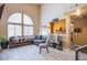 Airy living room with high ceilings, large arched windows, and neutral colors at 1933 Orchard Valley Dr, Las Vegas, NV 89142