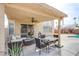 This covered patio features comfortable seating and a view of the pool at 1933 Orchard Valley Dr, Las Vegas, NV 89142