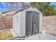 A gray vinyl shed provides additional storage in the backyard at 1933 Orchard Valley Dr, Las Vegas, NV 89142
