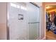The modern shower features white marble tile, pebble floor, and a built-in niche at 1933 Orchard Valley Dr, Las Vegas, NV 89142