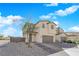 Charming two-story home featuring a two-car garage, landscaped front yard and brick steps at 2865 Victorian Rd, North Las Vegas, NV 89086