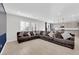 Open-concept living room featuring wood floors and a seamless flow into the kitchen area at 2865 Victorian Rd, North Las Vegas, NV 89086
