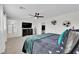 This modern main bedroom features a ceiling fan, TV, and en-suite bathroom for ultimate comfort at 2865 Victorian Rd, North Las Vegas, NV 89086