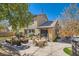 Backyard with stamped concrete patio and mature trees creates a perfect outdoor living space at 336 S Milan St, Henderson, NV 89015