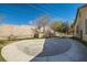 Backyard featuring a patio, block wall, and landscaped area with artificial turf at 336 S Milan St, Henderson, NV 89015