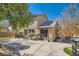 Backyard with stamped concrete patio and mature trees creates a perfect outdoor living space at 336 S Milan St, Henderson, NV 89015