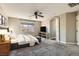 Comfortable bedroom with soft carpet, neutral walls, and a large window for natural light at 336 S Milan St, Henderson, NV 89015