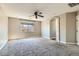 Large bonus room with carpet, window with backyard views, and recessed lighting at 336 S Milan St, Henderson, NV 89015