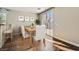 Cozy dining area features hardwood floors, access to the outdoor patio, and stylish decor at 336 S Milan St, Henderson, NV 89015