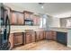 Well-equipped kitchen with stainless steel appliances, granite countertops, and wood cabinets at 336 S Milan St, Henderson, NV 89015