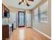 Bright kitchenette featuring wood cabinets, a microwave, and a window with natural light at 336 S Milan St, Henderson, NV 89015