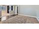 Spacious living room showcasing hardwood flooring, carpet, and built-in bookshelves at 336 S Milan St, Henderson, NV 89015