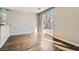 Bright living room with hardwood floors and sliding glass doors to the backyard at 336 S Milan St, Henderson, NV 89015