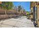 Spacious stamped concrete patio with string lights and mature trees at 336 S Milan St, Henderson, NV 89015