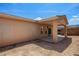 The backyard has a covered patio area, perfect for enjoying outdoor living and entertaining at 341 Grapevine Rd, Mesquite, NV 89027