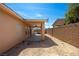 An extended covered patio and spacious backyard offer great outdoor living and entertaining at 341 Grapevine Rd, Mesquite, NV 89027