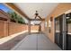 Covered patio includes a ceiling fan, recessed lights, and a view of the surrounding backyard at 341 Grapevine Rd, Mesquite, NV 89027