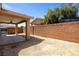 A vast backyard offers potential for customization, featuring a concrete patio and gravel landscape at 341 Grapevine Rd, Mesquite, NV 89027