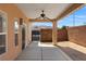 Enjoy the spacious backyard with its covered patio, concrete slab, and brick privacy wall at 341 Grapevine Rd, Mesquite, NV 89027
