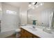 Bright bathroom with a combination tub/shower, vanity with a light wood finish, and ample counter space at 341 Grapevine Rd, Mesquite, NV 89027