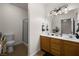 Bathroom featuring double sinks, tile floors, and shower stall at 341 Grapevine Rd, Mesquite, NV 89027