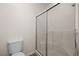 Bathroom features white tiled shower stall and toilet at 341 Grapevine Rd, Mesquite, NV 89027