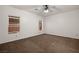 Bedroom features carpet floors, natural light, and a ceiling fan at 341 Grapevine Rd, Mesquite, NV 89027