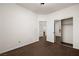 Bedroom featuring neutral carpet, closet with sliding doors and adjacent bathroom and bedroom views at 341 Grapevine Rd, Mesquite, NV 89027