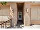 Covered walkway to the front door features decorative lighting and desert-style accents at 341 Grapevine Rd, Mesquite, NV 89027