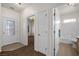Bright entryway featuring a decorative glass door, neutral walls, and tile and carpet flooring at 341 Grapevine Rd, Mesquite, NV 89027