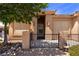 Charming stucco home with a small front yard area and desert landscaping at 341 Grapevine Rd, Mesquite, NV 89027