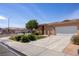 Well-maintained single-story home with desert landscaping and a two-car garage at 341 Grapevine Rd, Mesquite, NV 89027