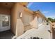 Home's stucco exterior features an entry door and a two-car garage at 341 Grapevine Rd, Mesquite, NV 89027
