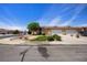 A well-maintained home with a two-car garage and desert landscaping at 341 Grapevine Rd, Mesquite, NV 89027