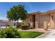 A well-maintained home with a two-car garage and well-kept lawn at 341 Grapevine Rd, Mesquite, NV 89027