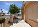 Inviting front porch with metal fencing, mature landscaping and tiled walkway leading to the front entrance at 341 Grapevine Rd, Mesquite, NV 89027
