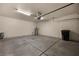 Spacious garage with concrete flooring, overhead lighting, and ample room for parking and storage at 341 Grapevine Rd, Mesquite, NV 89027